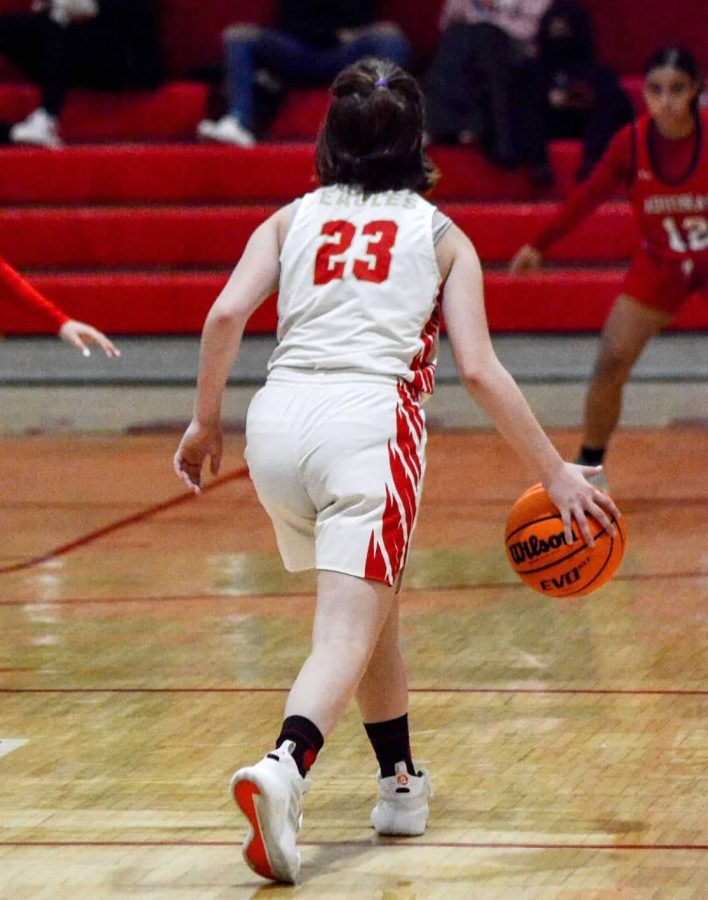 Jenna Rivella 22 playing basketball for Edison High School.