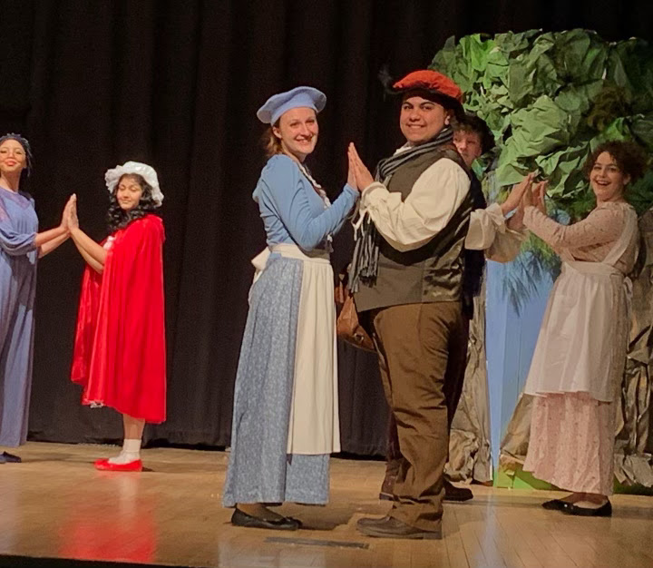 Many of the main characters of Into the Woods during the act one finale, when they believe to have found their happy ever after. From left to right is: Grandma (Sujude Hassan ‘24), Little Red Riding Hood (Riva Christy ‘24), The Baker’s Wife (Hannah Steinlauf ‘22), The Baker (Garid Garcia ‘22), Jack (Danny Boslet ‘22) and Jack’s Mom (Kaeli Knott ‘22).
Provided by Hannah Steinlauf 22
