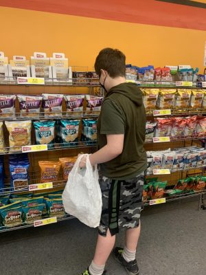 A student at Shoprite with his own recycled bag