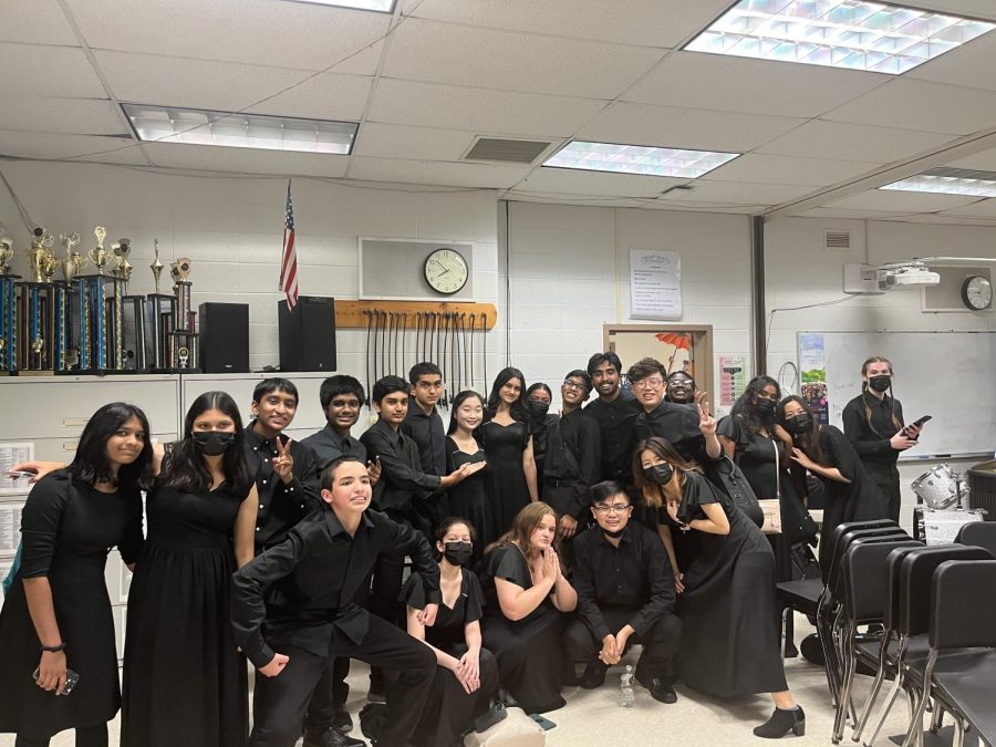 Orchestra students pose for a post-concert photo.