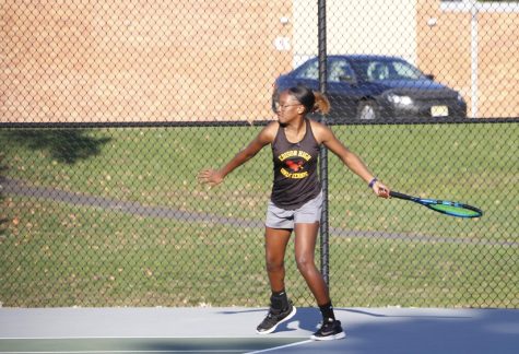 Khaliyah Revan 25 playing a singles match against John F. Kennedy Memorial High School.