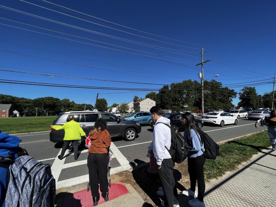 After school, students wait for traffic to clear to cross at the corner of Glenville Road and The Boulevard of Eagles.