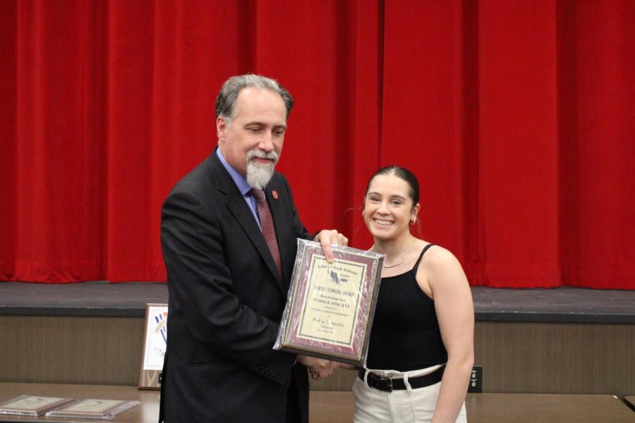 Hailey Zampella ‘23 receiving the Robert Coward  Award by principal Mr. Charles Ross on December 7th, 2022.