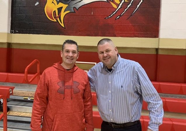 Mr. Timothy Root (at left), the EHS 2023 Educational Service Professional of the Year, poses in the FNC Gym with Athletic Director Mr. Dave Sandaal 90.
