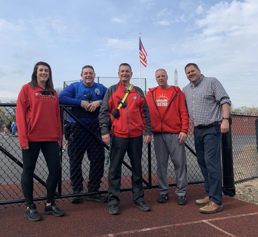 Mr. Timothy Root (center) on the field at Drwal Stadium with colleagues (from left) Ms. Kelly OBoyle, Mr. Dennis Warnick, Mr. Mike Meagher, and Mr. Dave Sandaal.