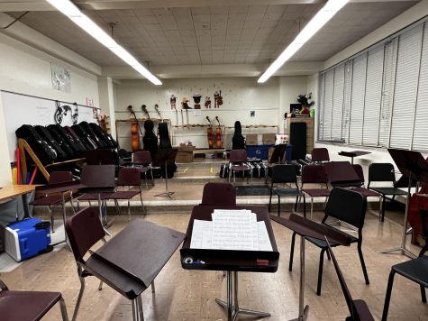 A picture of the current Orchestra Room, showcasing the limited storage space and seating
