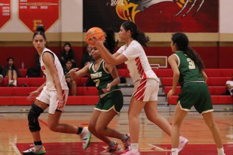 Keisha Ortiz 23 moves with the ball with Trista Whitney 26 during the January 5 game against J.P. Stevens.