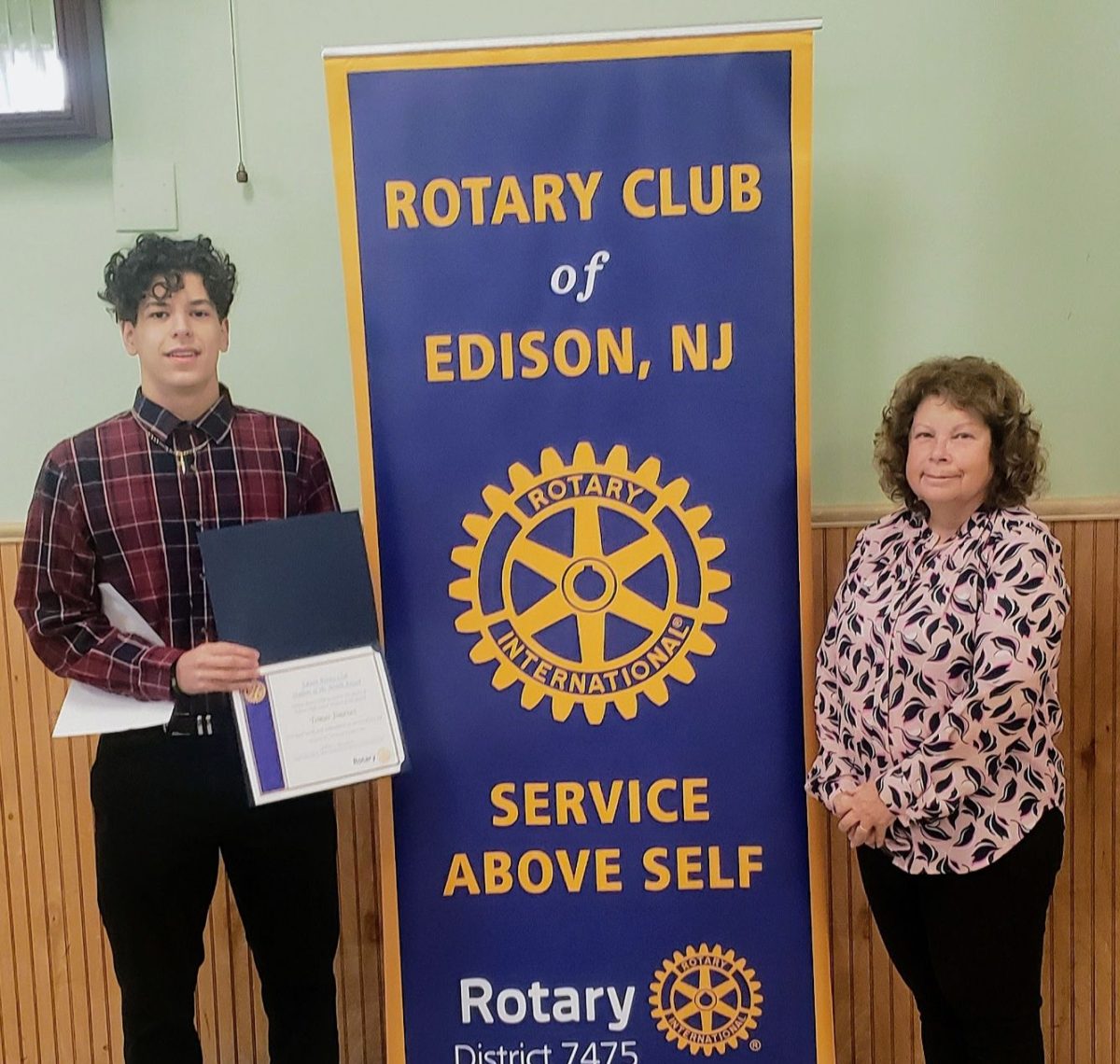 After receiving his award, Tomas Jimenez 24 poses with Judy Mansbach of Edison Rotary at the November Rotary SOTM Breakfast