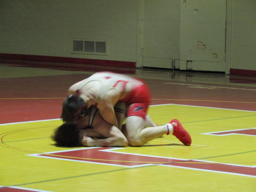 Caleb Gluchowski 26 holding a tight grip on his opponent.