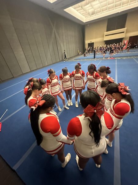The EHS Varsity Cheer team eagerly waits for the results of their competition. 