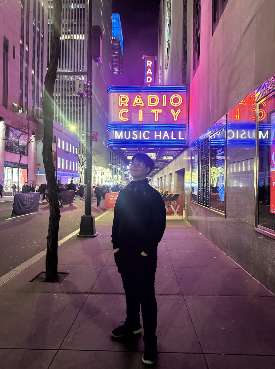 Jimmy Le, Februarys Rotary Senior of the Month, stands tall and upright in front of Radio City Music Hall.