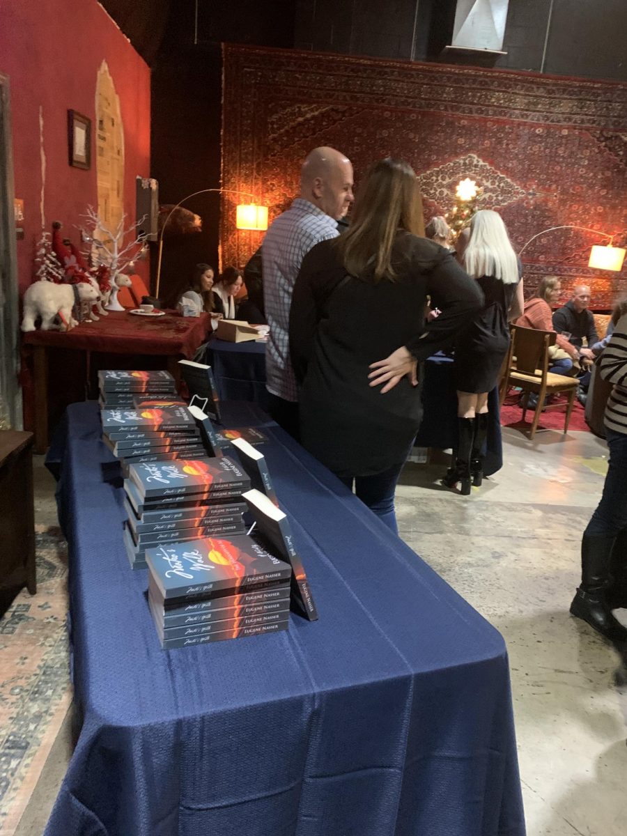 Copies of Mateos Walk, by EHS history teacher Dr. Gene Nasser, laid out for display and purchase at a book launch event in December 2023. 