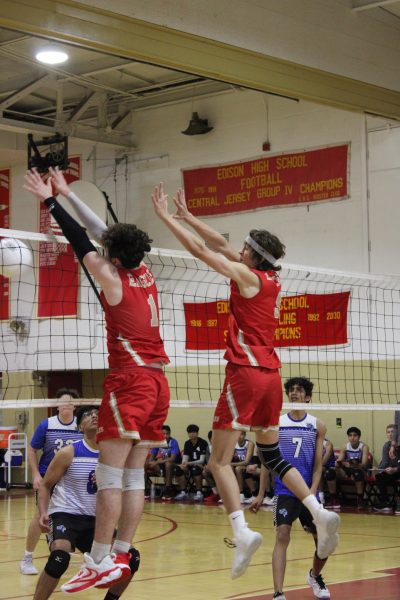 Adrian Zapala 24 and Brady Boslet 24 rise up for the block against an incoming attack by a hitter from the Old Bridge Knights.