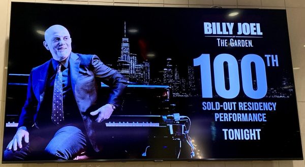 A concert graphic at Madison Square Garden displaying Billy Joels sold-out performance before the show.