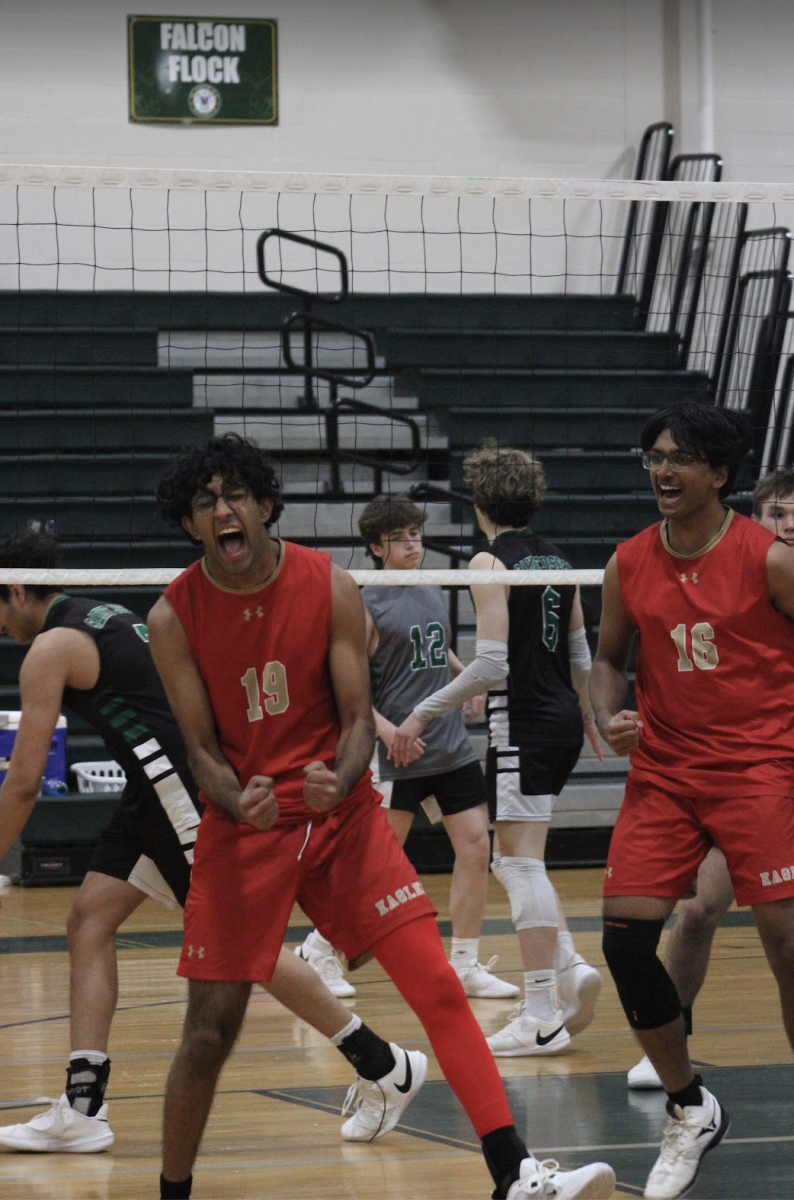 Mohammad Haady 24 (#19) and Abhiram Vemula 26 (#16) celebrate after winning a pivotal point against St. Joseph. 
