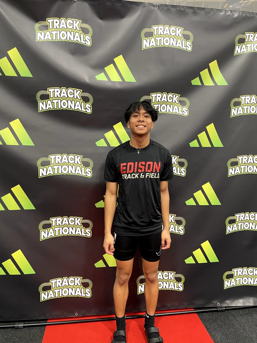 Shiloh Estoque 24, Aprils Rotary Senior of the Month, poses at Track Nationals where he represents the Edison High track and field team.