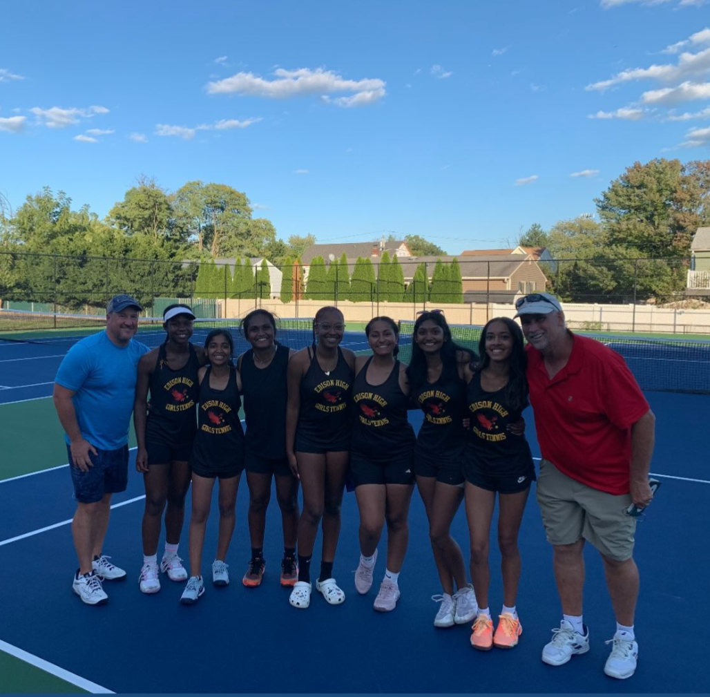 The Edison High girls varsity tennis team celebrates their streak-breaking win against J.P. Stevens High School.