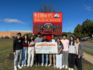 The EHS Lemelson-MIT InvenTeam stands by the EHS sign with their banner. From left: Aditya Rao '26, Ishani Bakshi '26, Divya Krishna '25, Zashaan Shaik '25, Vedant Talati '25, Mithil Mishra '25, Gauri Kshettry '25, Anthony Baio '26, Twisha Patel '25, and faculty advisor Ms. Jaslin Kaur.