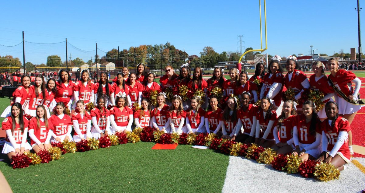 The Edison High Cheerleading Varsity and JV team pose for a picture at the Fall Pep Rally before they perform their half-time performance.