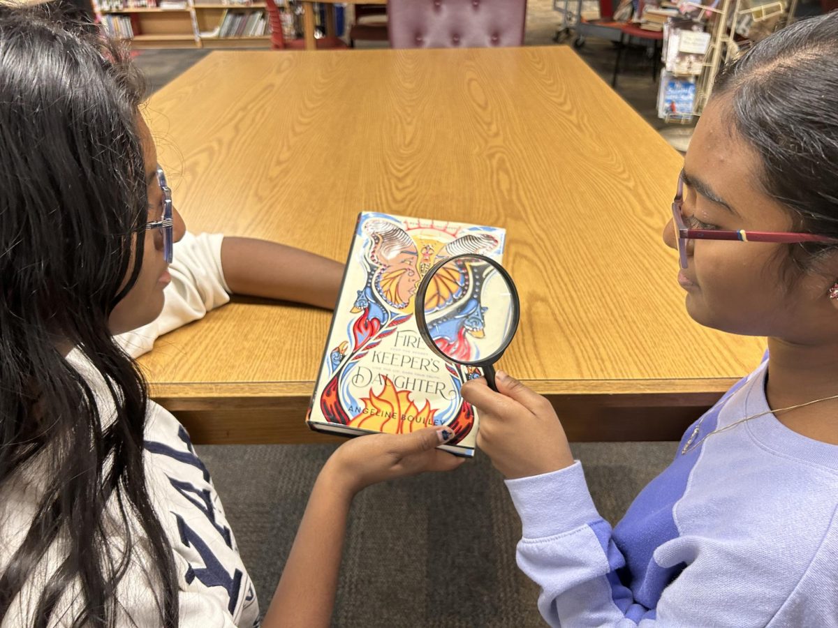 Rithika Gunasekaran '27 and Solai Ramasubramaniyam '27 delve deep into the intricate story of the "Firekeeper's Daughter" by Angeline Boulley. The book covers essential themes such as identity, coming-of-age, family and community, justice, and generational trauma.