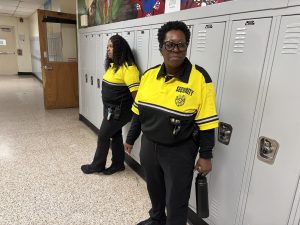 Ms. Tyshawn Finn (at left) and Ms. Linette Haynes monitor the halls near the Breezeway. They, like other guards, are posted at various locations around the school throughout the day, as well as doing walking patrols.