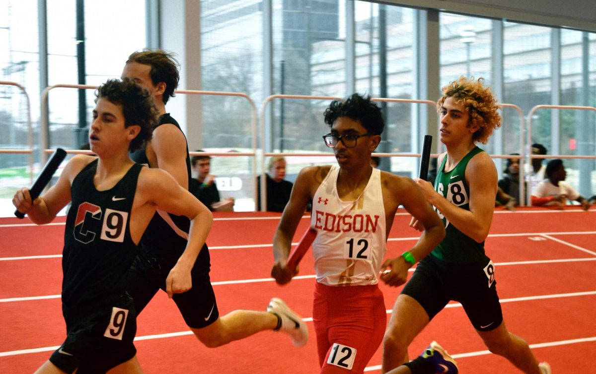 Tanush Lingala '27 moves towards the front of the pack in the Boys 4x800 Relay.