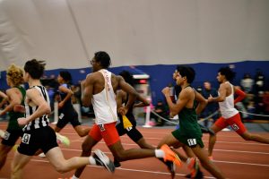 From left: Bryce Hickerson '26 and Moustafa Abdelaal '25 move up the pack in the Boys 800m Run.