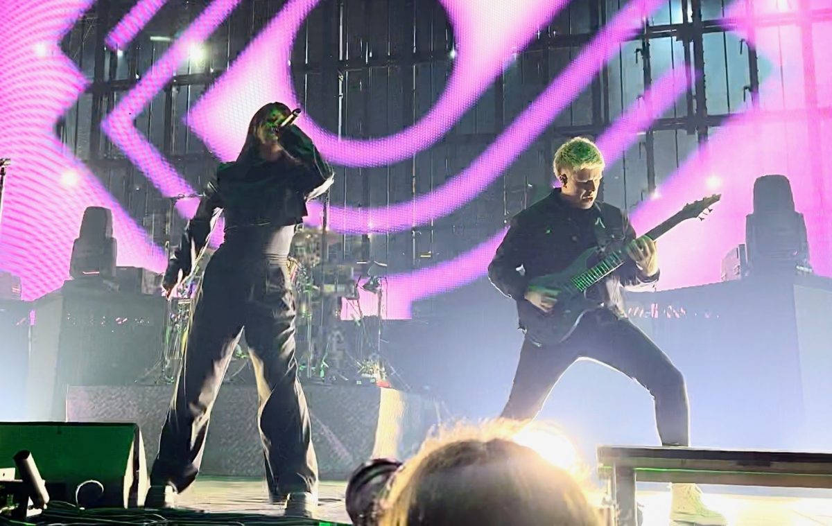 Courtney LaPlante unleashes her raw vocal talent onto the Prudential Center as her bandmates' lay down some brutal sounds on the guitar and drums.