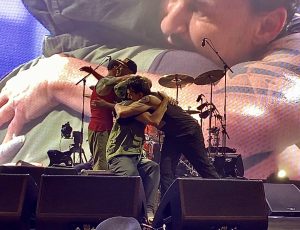 Rage Against the Machine shares a loving embrace after the “Battle of New York” at Madison Square Garden, the unforgettable concert that may go down as their last live performance ever.