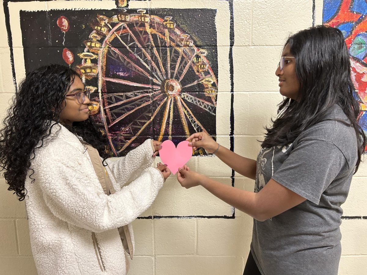 Solai Ramasubramaniyam '27 and Rithika Gunasekaran '27 enact the characters, Valentina and Jae, the two leads of the heartwarming YA graphic novel rom-com, Lunar New Year Love Story. The story, written by Gene Luen Yang and LeUyen Pham, emphasizes themes such as fate, family, and falling in love. 