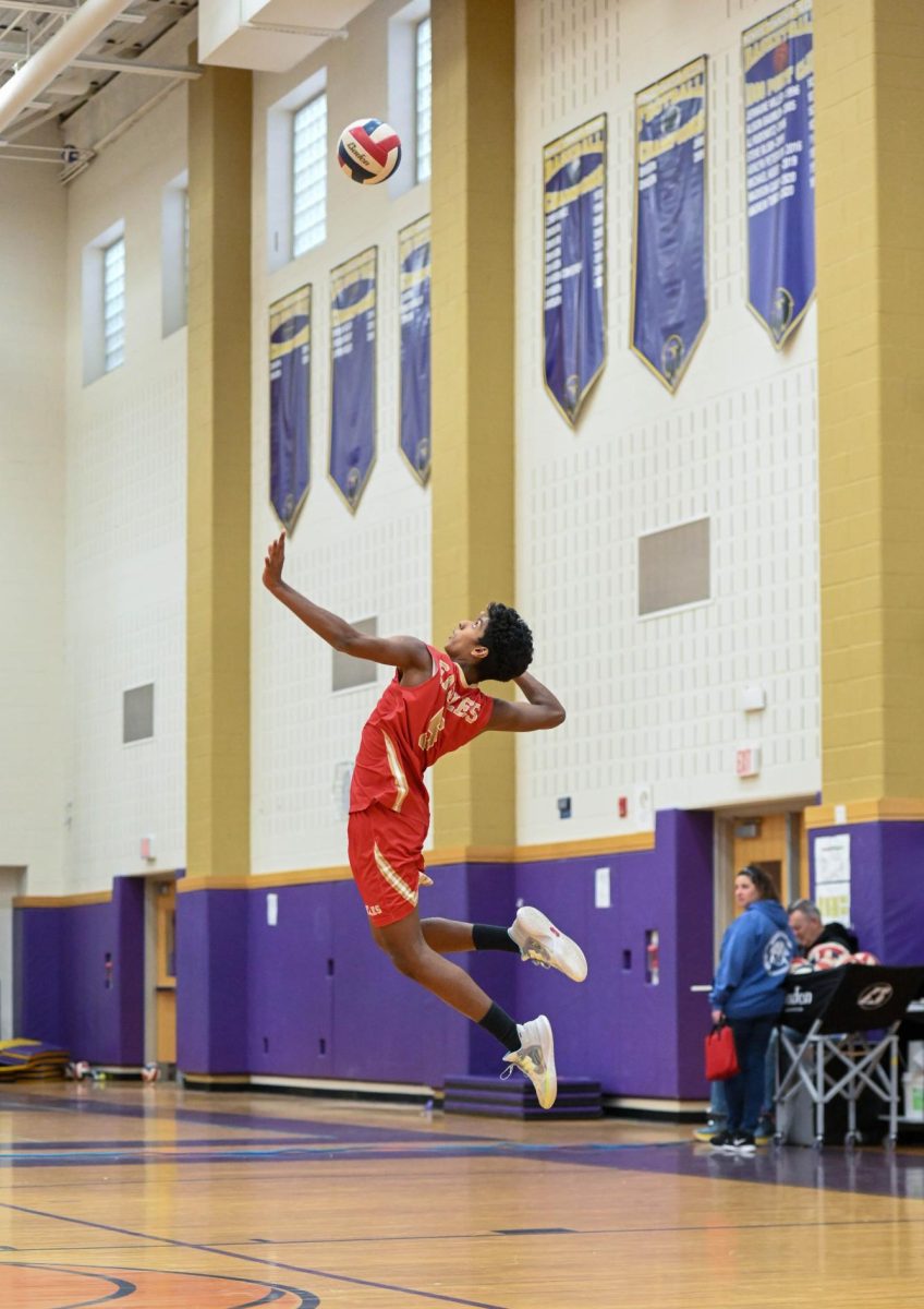 Rotary's February Senior of the Month, Ajit Pranav Sivakumar '25, showcasing his skills on the EHS boys varsity volleyball team