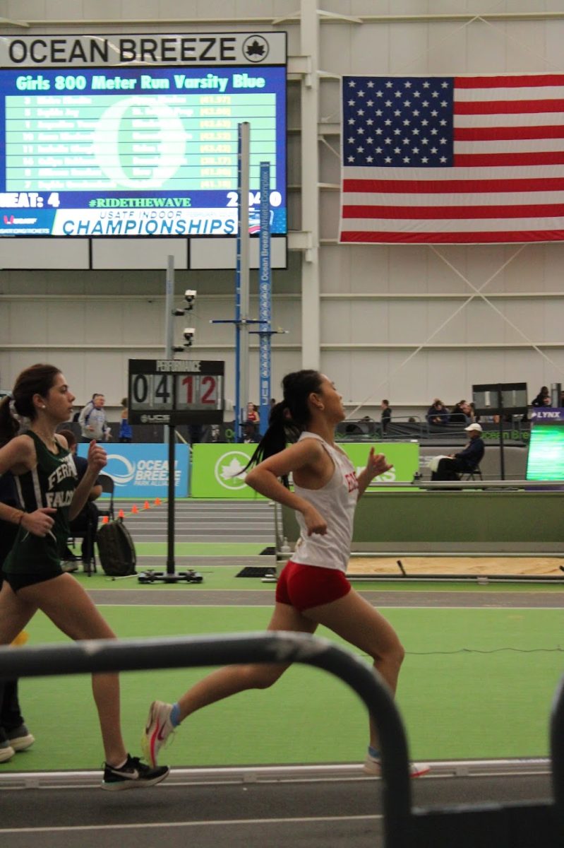 Anna Wang '26 competing in the 800-meter race as part of the Blue Division.