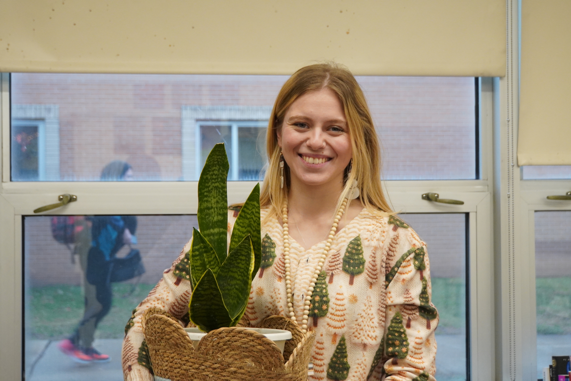 Former EHS alum Ms. Samantha Belle '19 can often be seen near her class plant and reading a good book. She prioritizes seeing growth and collaboration in students.