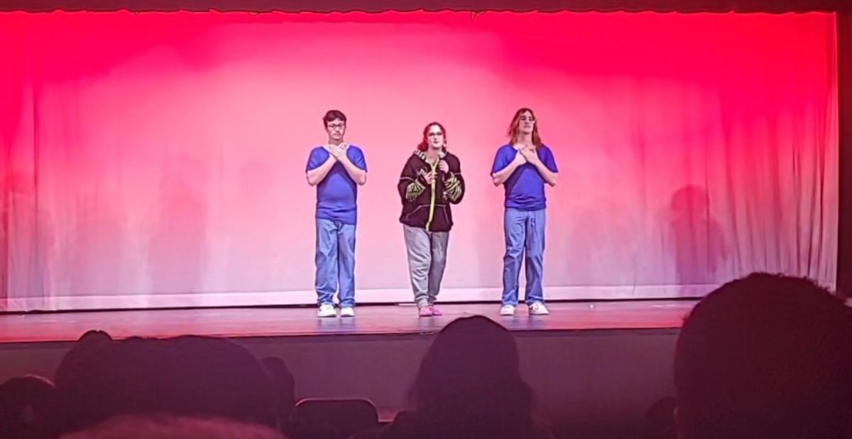 Quin Snyder '25 does her solo cover of "Scatterbrain" by Emei with background dancers.