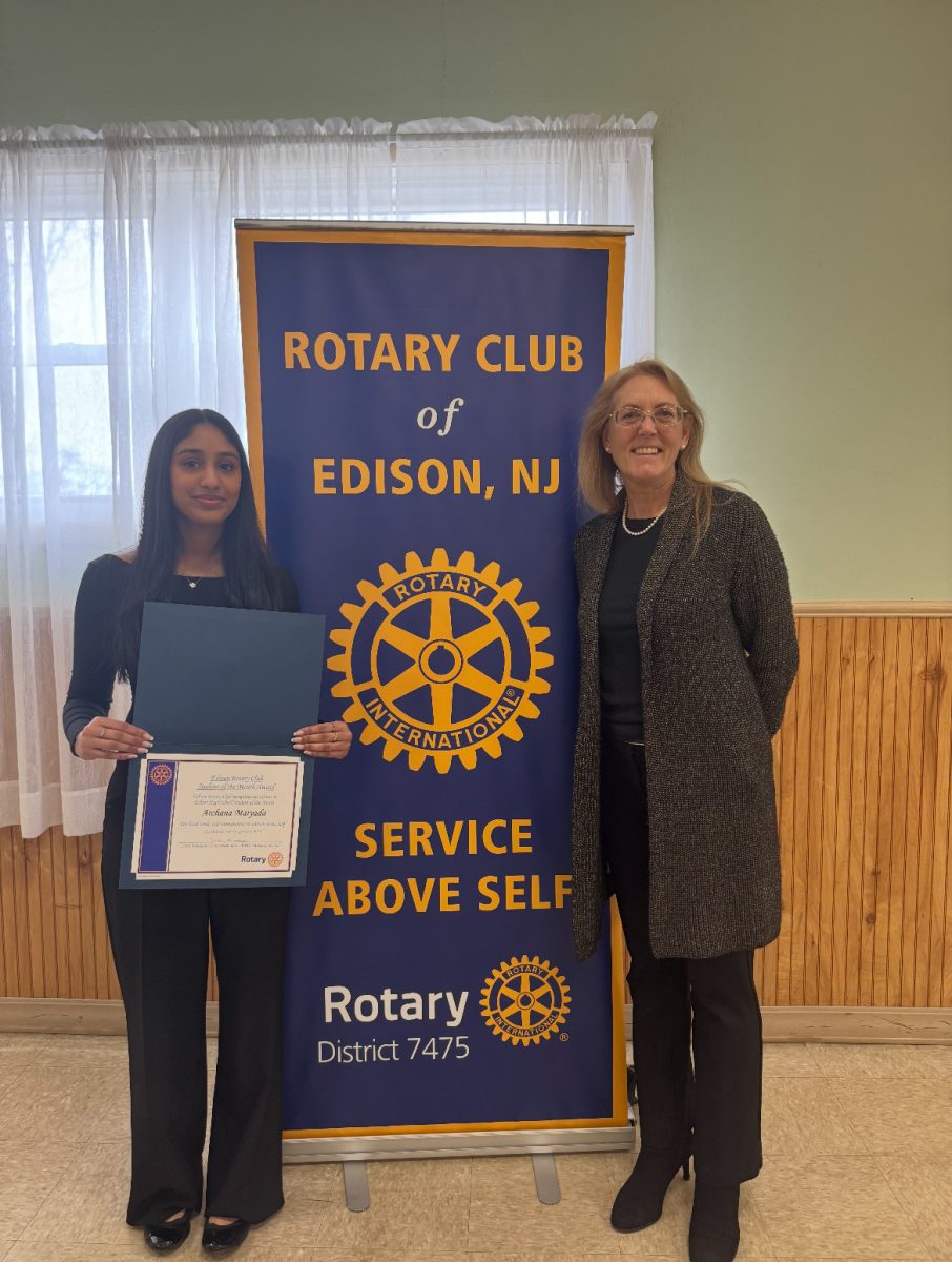Archana Maryada '25 and Rotary's April Senior of the Month posing with her certificate in hand alongside her teacher, Business teacher Lynne Tierney.