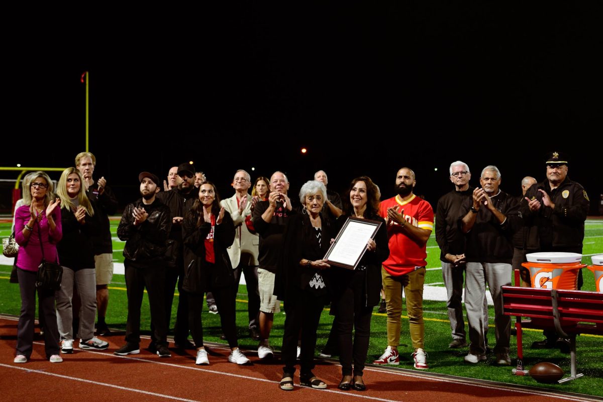 Family and friends applaud the legacy of  of the late Mr. James Muldowney during his remembrance ceremony.