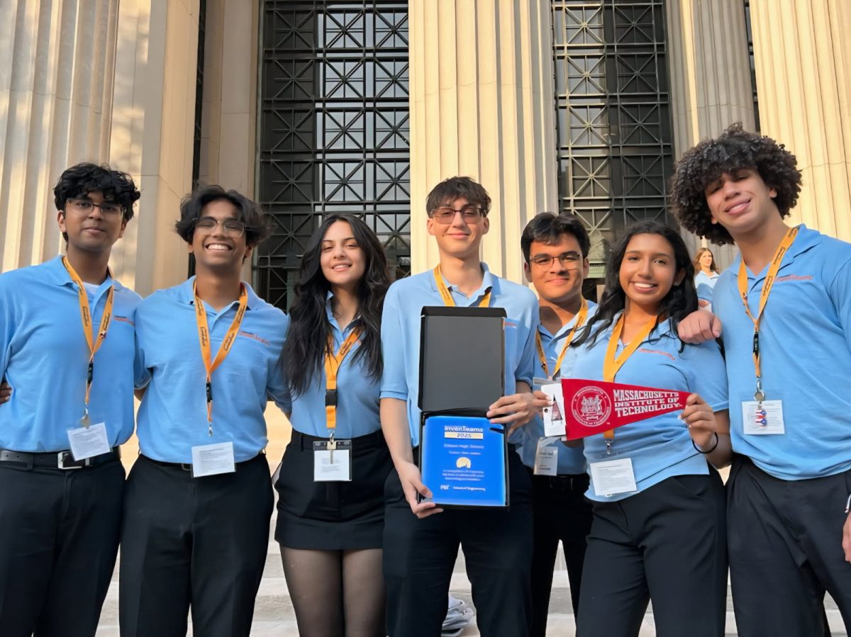 Rotary's September Senior of the month, Aditya Rao '26, holds a plaque recognizing his team's achievements for their Lemelson-MIT InvenTeam project.