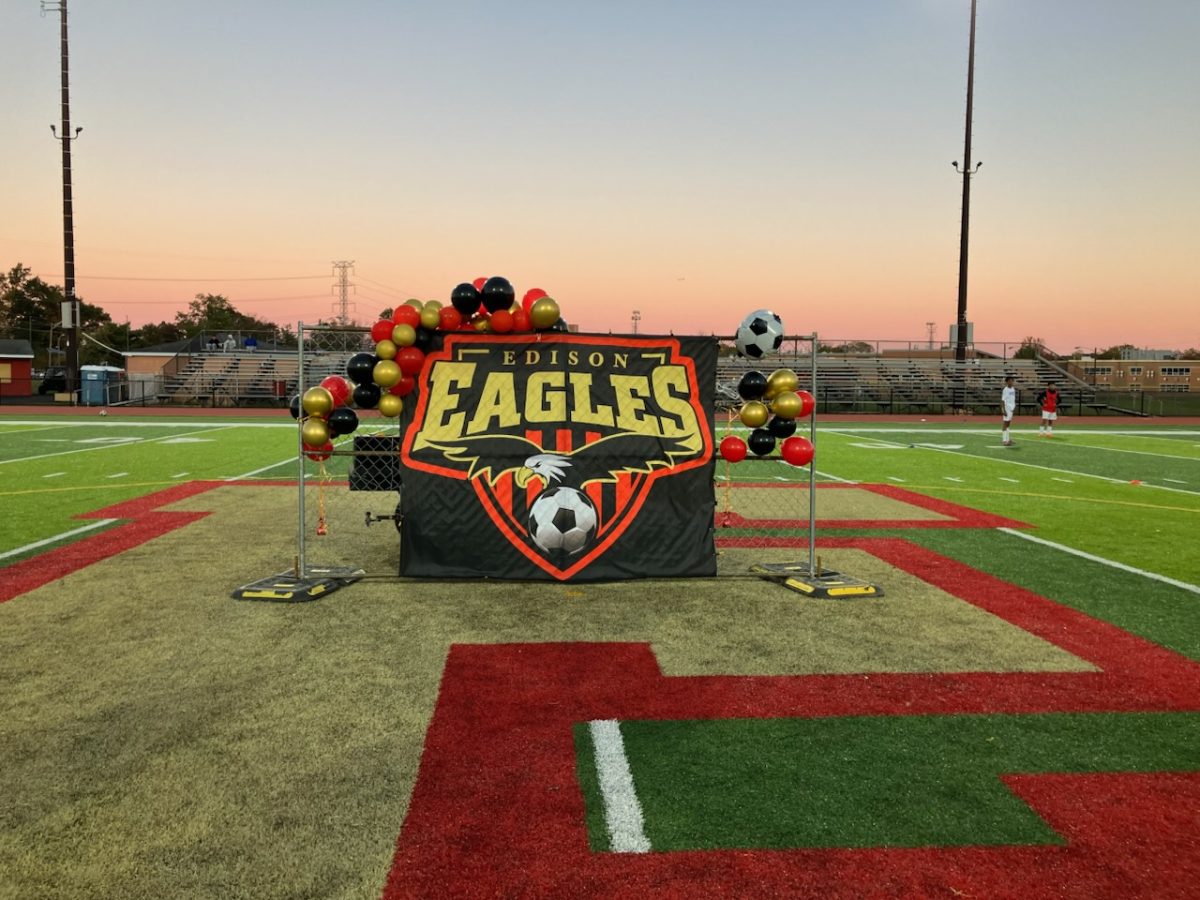  In celebration of the boys soccer team's graduating seniors, a fence panel was decorated with a poster and balloons.
