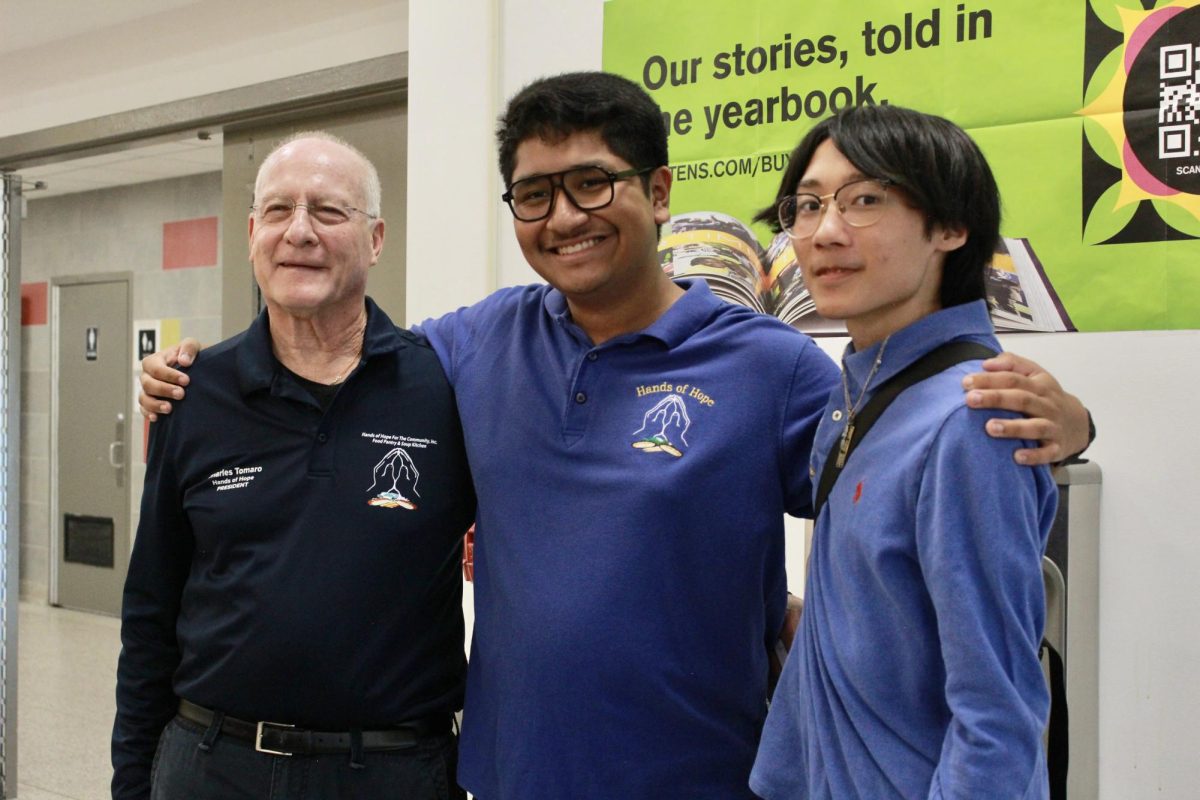 (from left to right), Charles Tomaro, Hands of Hope President; Chris Saavedra '26, Youth Ambassadorship Program President; and Kayen Lo '26, Youth Ambassadorship Program Vice President, introduce the organization during an informative session at EHS.