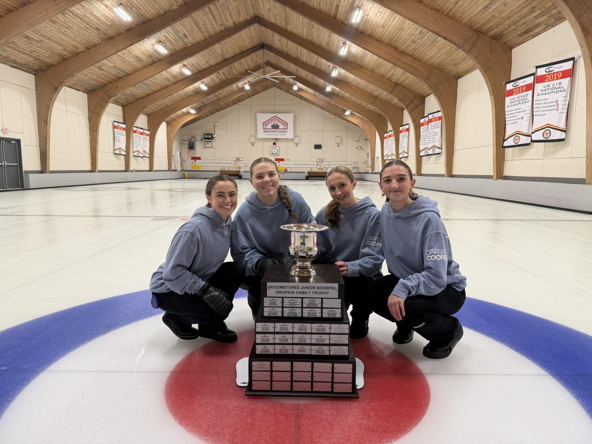 (second from left) Kalina Petrova '27 and her teammates celebrate their bronze medal win at the 2026 USA Curling U18 Junior Nationals in Colorado.