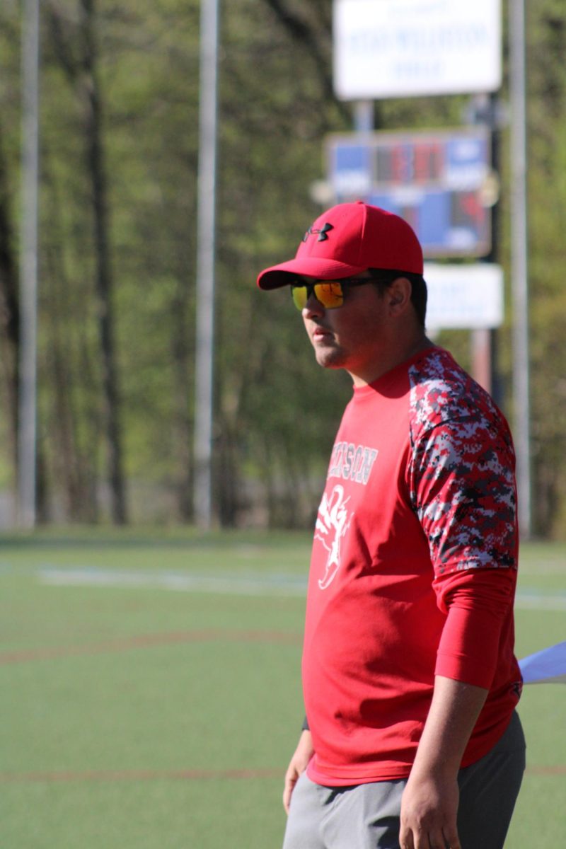 Coach Michael Yascko '18 is seen teaching boys' lacrosse in the spring season, having guided the team in recent years with his expertise.