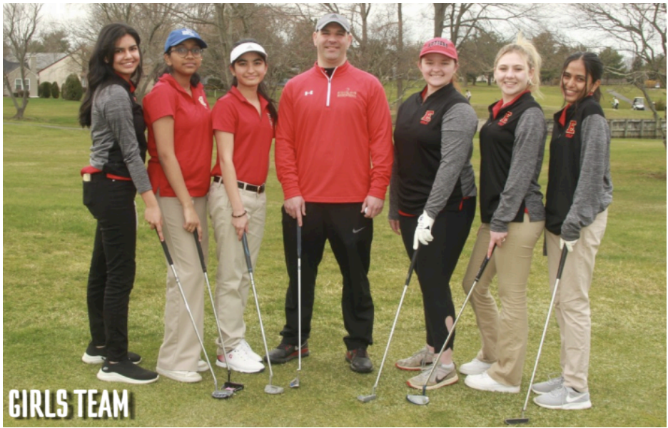 Head Coach Frank Juliano poses with the Edison High School girls' golf team. Juliano, who has coached the program for ten years, emphasizes patience, confidence, and mentorship as the team continues to grow.