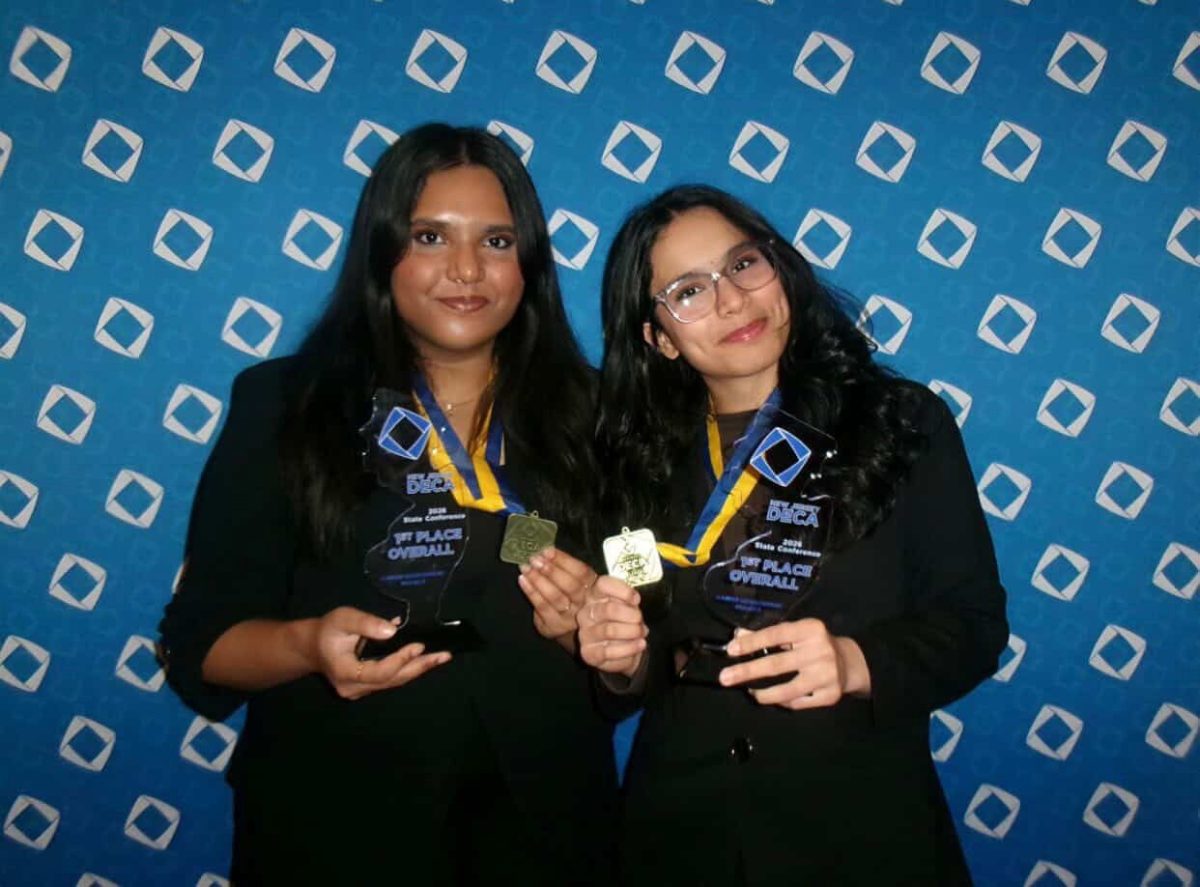 Hasini Vummaji '27 and Aditi Goje '27 win first-place NJ DECA glass in the Project Management Career Development event with their international initiative focused on financial literacy.