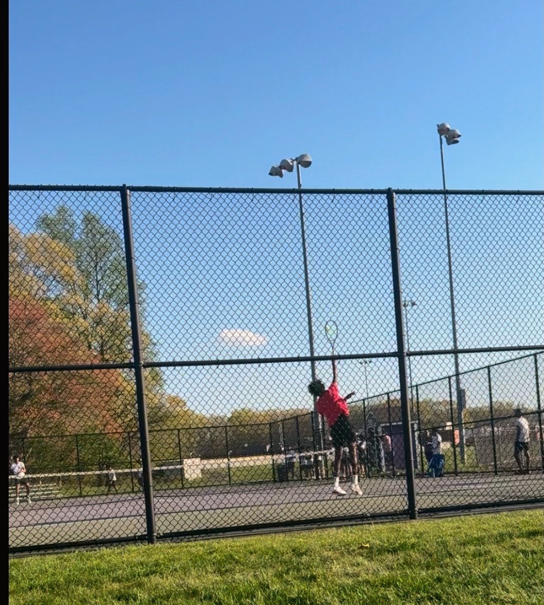 Vinieth Elango '27 reaches for an overhead shot against Edison Magnet. The match provided a confidence boost for the team heading into the rest of the season.