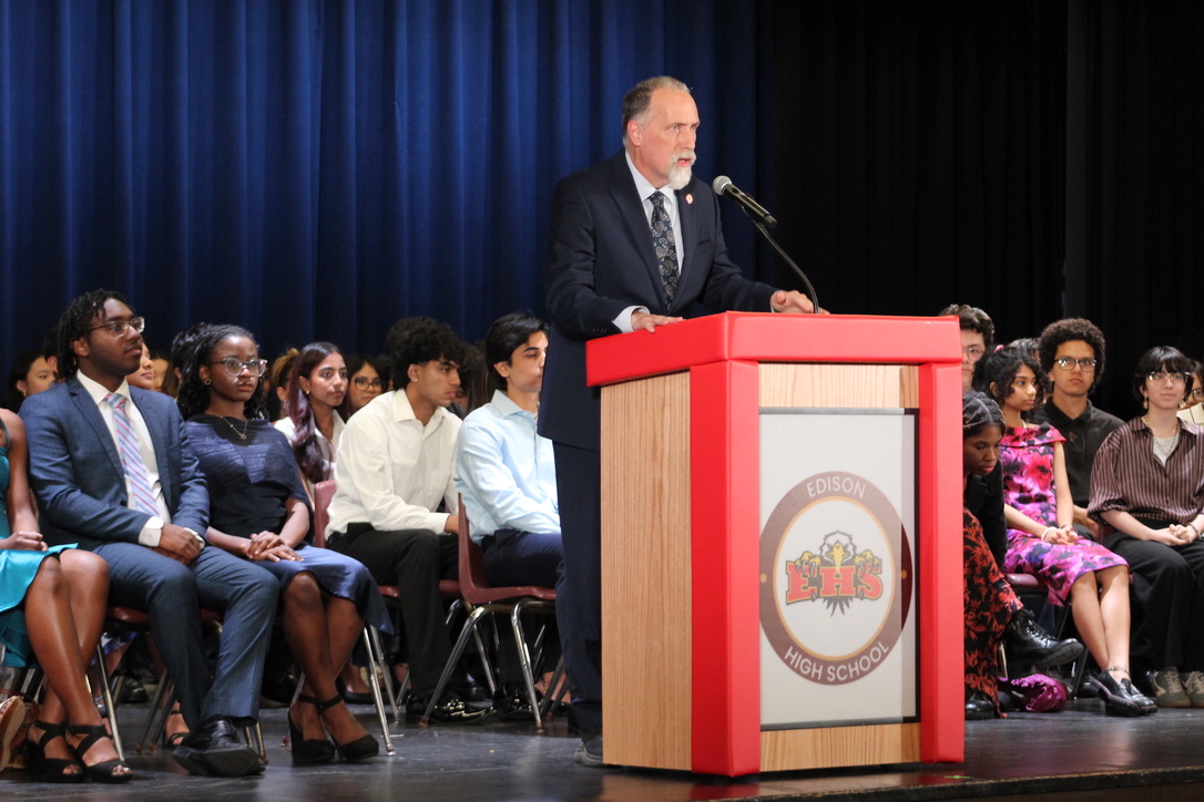 Principal Mr. Charles Ross speaks to the graduating class during Senior Night after receiving the Grand Lodge Distinguished Citizenship Award.