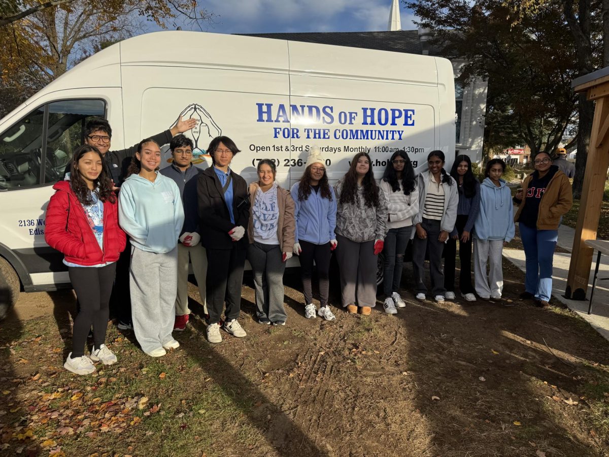 (From left) Adriana Rymer '27, Chris Saavedra '26, Arianna Arias '27, Muhammad Ahmad '26, Kayen Lo '26, Samantha Brea '27, Shelsy Avila '26, Scarlett Gil '27, Ashmita Balaazhagan '27, Naimisha Kanamarlapudi '26, Diya Patel '27, and Paola Macias '26 pose for a group picture following a distribution.
